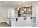 Modern kitchen showcasing granite countertops, breakfast bar, stainless steel appliances, and dark wood cabinets at 4051 Whittier Ln, Fort Mill, SC 29708