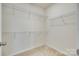 Spacious walk-in closet with ample shelving offers abundant storage, perfect for organizing wardrobes and personal items at 4051 Whittier Ln, Fort Mill, SC 29708