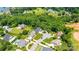 Aerial view of a neighborhood with manicured lawns, mature trees, and well-maintained homes at 4431 1St Street Nw Dr, Hickory, NC 28601