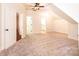Large carpeted bedroom with white trim, ceiling fan, and multiple doorways to other rooms at 4431 1St Street Nw Dr, Hickory, NC 28601