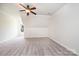 Spacious bedroom featuring a ceiling fan, neutral carpet, and a window for natural light at 4431 1St Street Nw Dr, Hickory, NC 28601