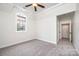 Bright bedroom with a ceiling fan and large window offers comfort at 4431 1St Street Nw Dr, Hickory, NC 28601