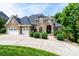 Elegant stone home with a three-car garage and beautifully landscaped front yard at 4431 1St Street Nw Dr, Hickory, NC 28601