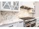 A modern kitchen featuring granite countertops, white cabinets, and stainless steel oven and cooktop at 4431 1St Street Nw Dr, Hickory, NC 28601