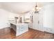 Elegant kitchen with granite countertops, a spacious island, and stylish chandelier at 4431 1St Street Nw Dr, Hickory, NC 28601