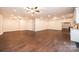 Spacious open living area with hardwood flooring, multiple ceiling fans, and recessed lighting at 4431 1St Street Nw Dr, Hickory, NC 28601