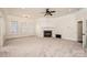 Spacious living room boasts a fireplace and large windows for natural light and comfortable living at 4431 1St Street Nw Dr, Hickory, NC 28601