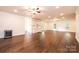 Large living room features hardwood floors, recessed lights, and an adjacent kitchen area at 4431 1St Street Nw Dr, Hickory, NC 28601