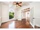 Bright living room with hardwood floors, white trim, and large windows, offering ample natural light at 4431 1St Street Nw Dr, Hickory, NC 28601