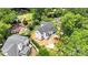 Aerial view of a new home construction in a leafy neighborhood, showcasing the roof and backyard layout at 4918 Buckingham Dr, Charlotte, NC 28209