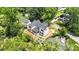 Aerial view of a new construction home surrounded by lush trees, showcasing the property's location and neighborhood at 4918 Buckingham Dr, Charlotte, NC 28209