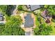 Aerial view of a new home with gray roof surrounded by lush green trees in a residential neighborhood at 4918 Buckingham Dr, Charlotte, NC 28209