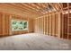 Unfinished bedroom space features natural light from the window and a spacious area for custom design at 4918 Buckingham Dr, Charlotte, NC 28209