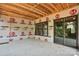 Covered patio area ready for customization, with sliding glass doors and windows to connect indoor and outdoor spaces at 4918 Buckingham Dr, Charlotte, NC 28209