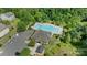 Aerial view showcasing the community pool, clubhouse, and surrounding wooded area at 5008 Social Cir, Fort Mill, SC 29707