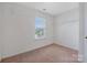 Cozy bedroom features natural light and neutral carpet with ample closet space at 5008 Social Cir, Fort Mill, SC 29707