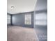 Bedroom featuring neutral walls and two windows providing ample natural light at 5008 Social Cir, Fort Mill, SC 29707