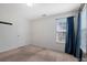 Bright bedroom with plush carpet, and window with blue curtain at 5008 Social Cir, Fort Mill, SC 29707
