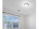 Bright bedroom features a large window providing ample natural light, complemented by fresh white walls at 5008 Social Cir, Fort Mill, SC 29707