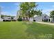 A beautiful front yard with a two-story home including lush green grass and a mature shade tree at 5008 Social Cir, Fort Mill, SC 29707