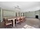 Open-concept living area featuring a fireplace, dining area, and decorative wall details at 5008 Social Cir, Fort Mill, SC 29707