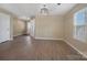 Spacious living room provides wood flooring, natural light from the double window, and access to other rooms at 5008 Social Cir, Fort Mill, SC 29707