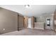Open loft area featuring neutral walls, plush carpet, and multiple doorways at 5008 Social Cir, Fort Mill, SC 29707