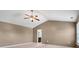 Spacious main bedroom with vaulted ceilings and ceiling fan, leading into the ensuite at 5008 Social Cir, Fort Mill, SC 29707