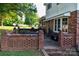 This backyard features a brick patio area perfect for outdoor dining and entertaining at 7448 Forney Hill Rd, Denver, NC 28037