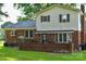 This home's backyard features a brick patio area perfect for outdoor dining and entertaining at 7448 Forney Hill Rd, Denver, NC 28037