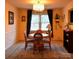 Traditional dining room with chandelier, matching table, and chairs at 7448 Forney Hill Rd, Denver, NC 28037