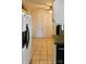 Spacious kitchen with ample storage, including white cabinets and tile floors at 7448 Forney Hill Rd, Denver, NC 28037