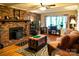 Bright living room features a fireplace, hardwood floors, and ample natural light at 7448 Forney Hill Rd, Denver, NC 28037