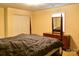 Spacious main bedroom with a large bed, dresser, and ample closet space at 7448 Forney Hill Rd, Denver, NC 28037