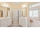 Bathroom featuring double sinks, a walk-in shower, and a mirror at 8115 Wilburn Ct, Charlotte, NC 28277