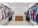 Walk-in closet with lots of storage and built-in shelving at 8115 Wilburn Ct, Charlotte, NC 28277