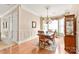 Elegant dining room with hardwood floors, crown molding, and large windows with natural light at 8115 Wilburn Ct, Charlotte, NC 28277