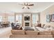 Spacious living area with fireplace, large windows, and open access to the dining room at 8115 Wilburn Ct, Charlotte, NC 28277