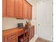 Convenient office nook with custom cabinetry and desk area located off the kitchen at 8115 Wilburn Ct, Charlotte, NC 28277