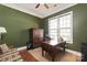 Home office featuring a wooden desk, built-in storage, and a comfortable daybed at 8115 Wilburn Ct, Charlotte, NC 28277
