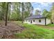 Exterior rear of the home, backing to a private, wooded lot at 813 Montreat Dr, Dallas, NC 28034