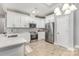 Bright kitchen with stainless steel appliances, modern cabinets, and quartz countertops at 813 Montreat Dr, Dallas, NC 28034