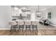 Modern kitchen featuring stainless steel appliances, an island, and an adjacent dining area at 813 Montreat Dr, Dallas, NC 28034