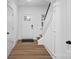Bright entryway with hardwood floors and staircase, showcasing a welcoming entrance at 8315 Adrian Ct, Charlotte, NC 28270