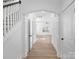 Hallway showing hardwood floors and white trim; lots of natural light in background at 8315 Adrian Ct, Charlotte, NC 28270