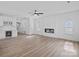 Bright living room with hardwood floors, modern fireplace, and a beverage center at 8315 Adrian Ct, Charlotte, NC 28270