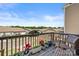 Charming balcony featuring wooden railing, potted plants, and neighborhood views at 8316 Waxhaw Hwy, Waxhaw, NC 28173