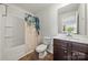 Bathroom with vanity, sink, toilet, and shower featuring a curtain at 8316 Waxhaw Hwy, Waxhaw, NC 28173