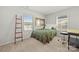 Bright bedroom with two windows, desk, and comfortable furnishings at 8316 Waxhaw Hwy, Waxhaw, NC 28173