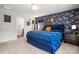 Bedroom showcasing blue accent wall, plush carpeting, and neutral decor at 8316 Waxhaw Hwy, Waxhaw, NC 28173